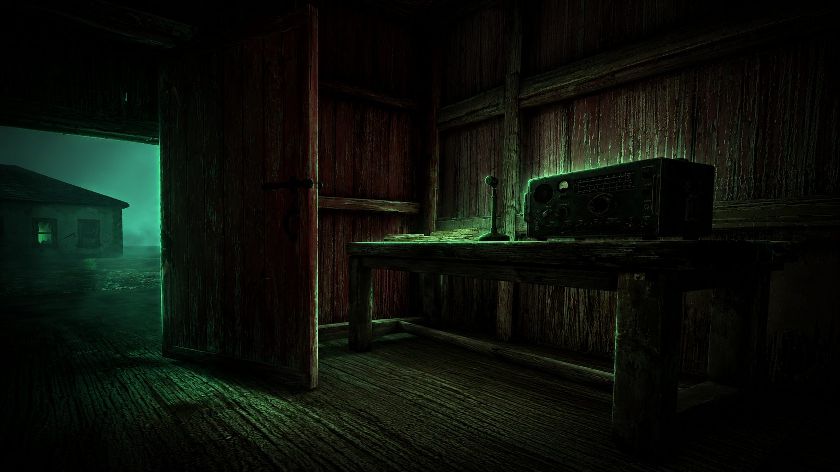 The barn comms station at night — a vintage radio transceiver on a workbench, the residence glowing green through the open door